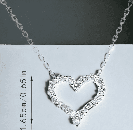 Silver Heart pendant necklace adorned in gem stones