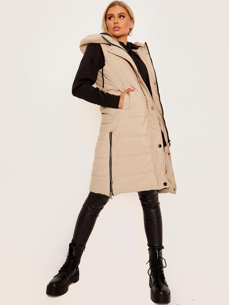 Women wearing a stone coloured Longline Hooded Gilet