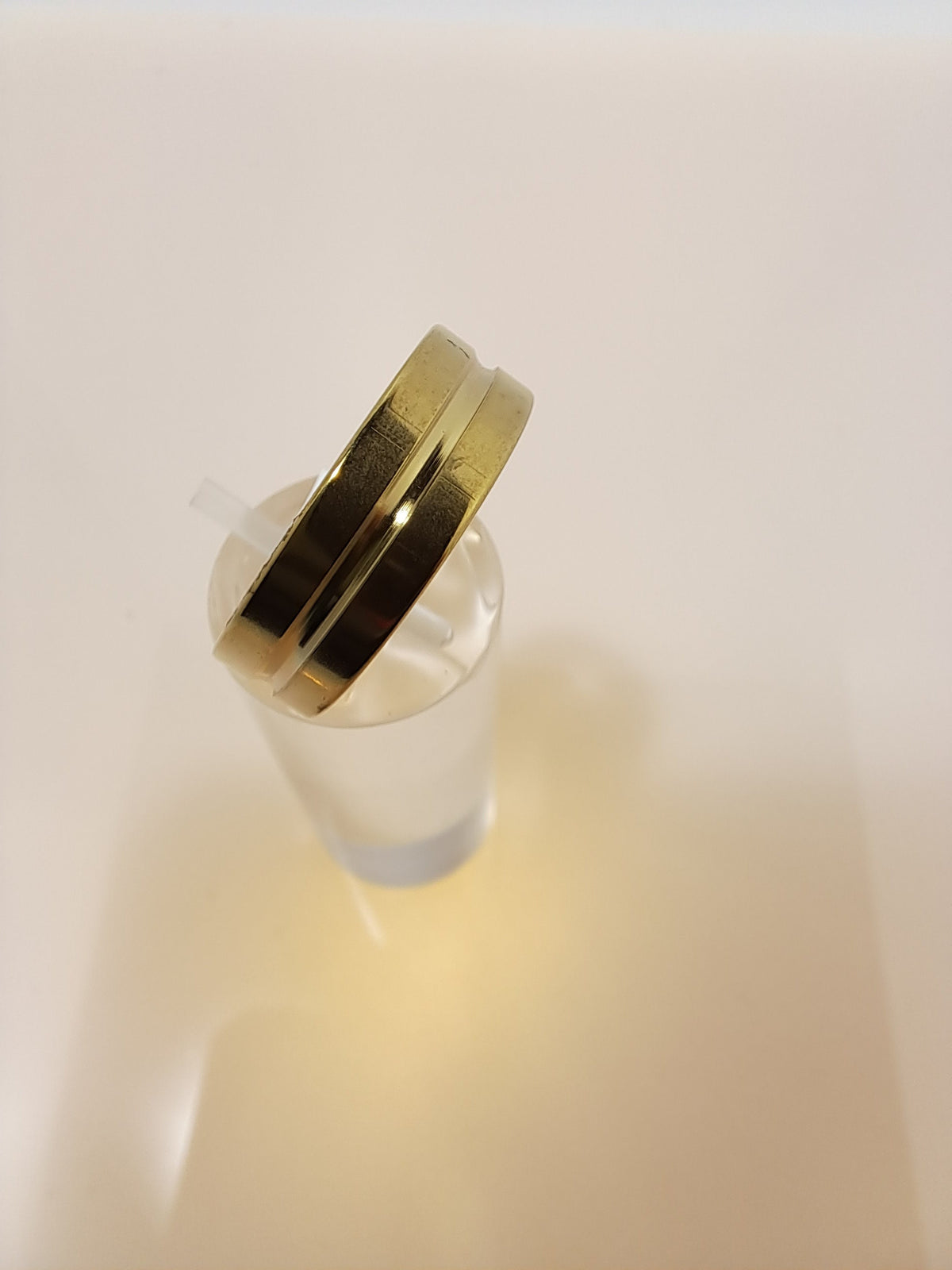 Gold stainless steel unisex ring with a rounded channel around the band. Perfect costume jewellery.